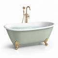 Baignoire îlot acrylique vert pastel avec pieds dorés et robinet